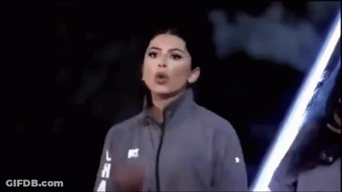 Woman Blowing Kiss With Lightsaber In Dark GIF