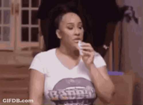 Woman Blowing Nose With Tissue In Purple Shirt GIF