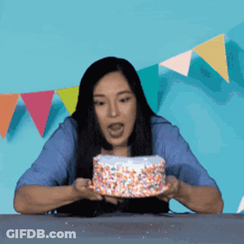 Woman Blowing Out Birthday Candle GIF