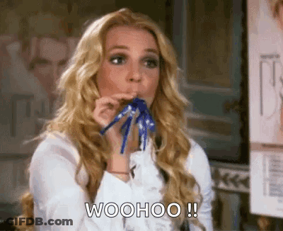 Woman Blowing Party Horn Saying Woohoo GIF