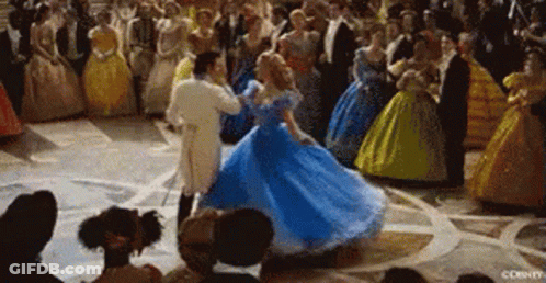 Woman Blue Dress Dances With Man White Suit GIF