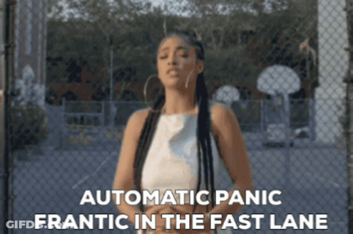 Woman By Chain Link Fence With Automatic Panic Frantic In Fast Lane GIF