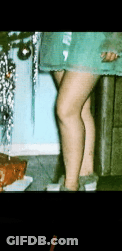 Woman By Christmas Tree GIF