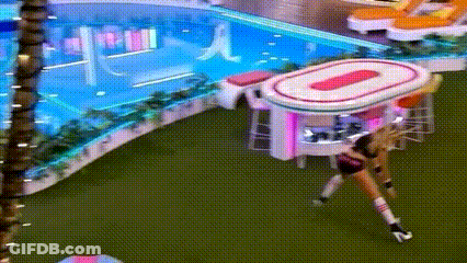 Woman By Pink And White Table In Pool Area GIF