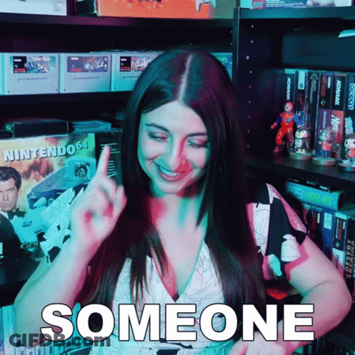 Woman By Shelf With Nintendo Box GIF