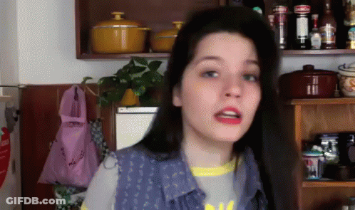 Woman By Shelf With Pots And Bottles GIF