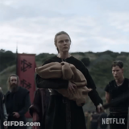 Woman Carrying Blanket In Front Of Netflix Banner GIF