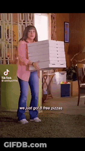 Woman Carrying Stack Of Pizza Boxes GIF