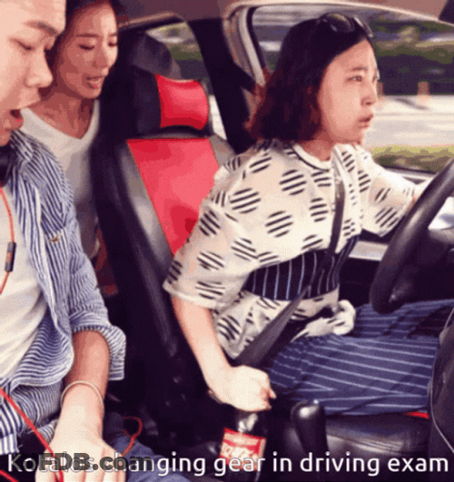 Woman Changing Gear In Driving Exam GIF