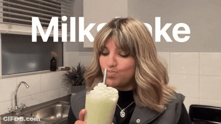 Woman Cheers Milkshake GIF