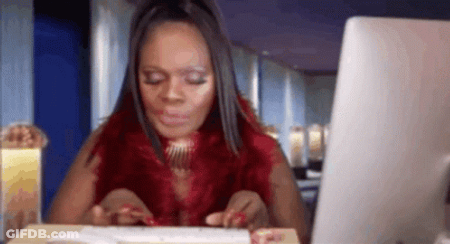Woman Chewing While Typing On Keyboard GIF
