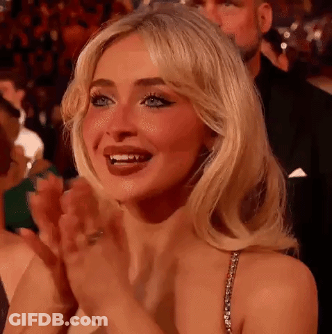Woman Clapping In Crowd At Party GIF