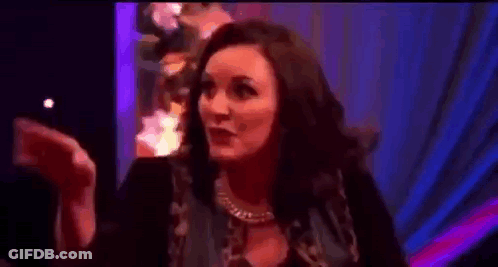 Woman Clapping In Dark Room With Purple Light GIF