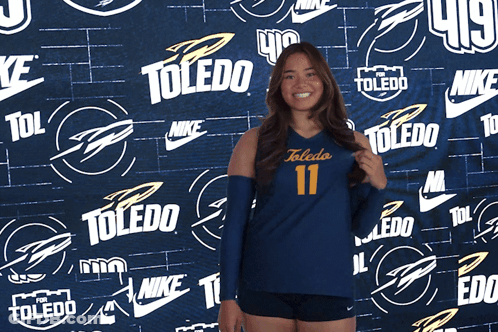 Woman Clapping In Front Of Nike Toledo Wall GIF