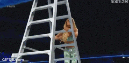 Woman Climbing Ladder In Wrestling Ring GIF