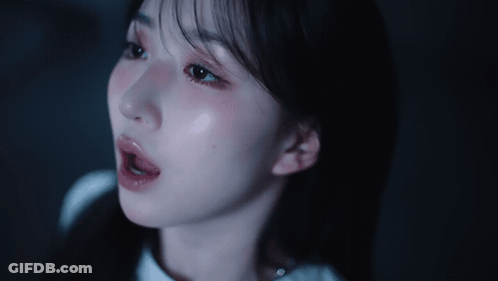 Woman Close Up In Dark GIF