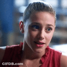 Woman Close Up In Red Shirt With Ponytail GIF