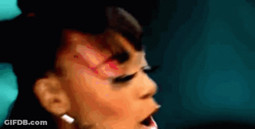Woman Close Up Mouth Open With Earrings GIF
