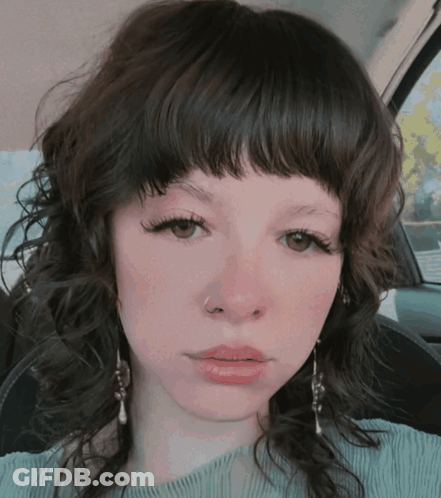 Woman Close-Up With Earrings GIF
