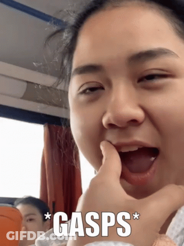 Woman Close Up With Gasp GIF