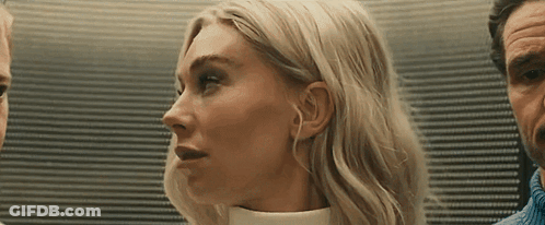 Woman Close Up With Man Behind GIF