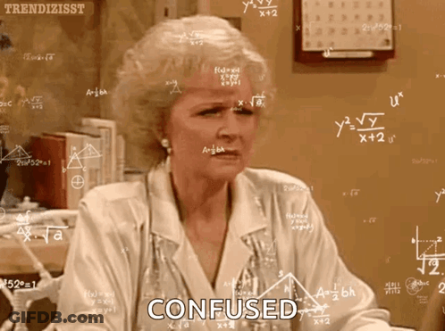 Woman Confused At Chalkboard With Equations GIF