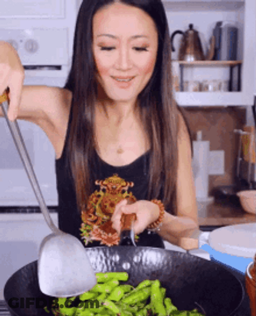 Woman Cooking Peppers GIF
