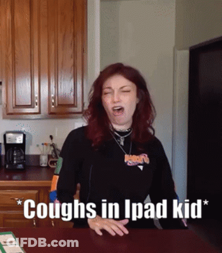 Woman Coughs In Kitchen Saying Coughs In Ipad Kid GIF