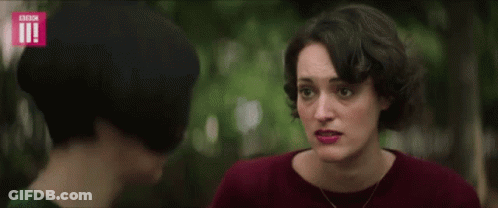 Woman Covering Ears As Another Looks GIF