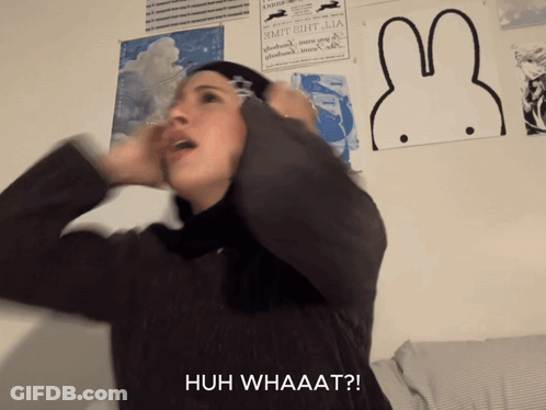 Woman Covering Ears With Huh Whaaat GIF