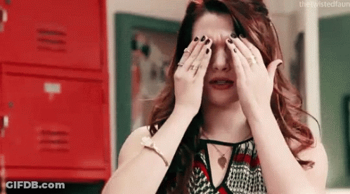 Woman Covering Eyes While Crying GIF