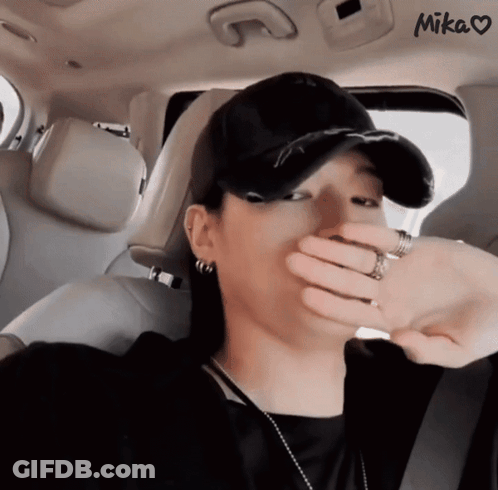 Woman Covering Face In Car GIF