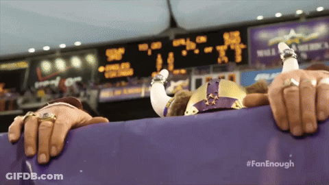 Woman Covering Face In Front Of Crowd GIF