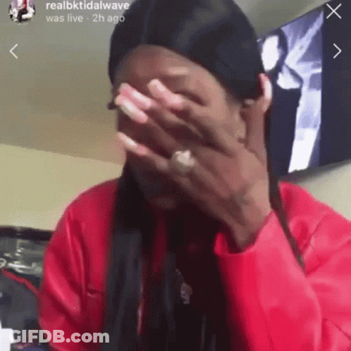 Woman Covering Face In Red Jacket GIF