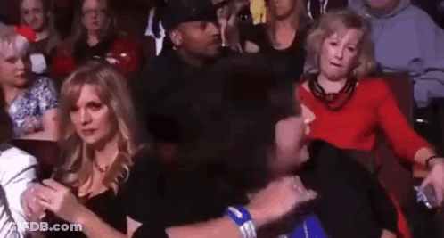 Woman Covering Face While Holding Phone GIF