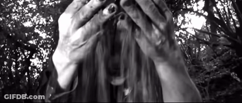 Woman Covering Face With Hands In Black And White Photo GIF