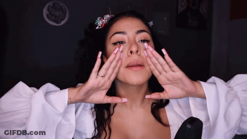 Woman Covering Face With Hands White Top GIF