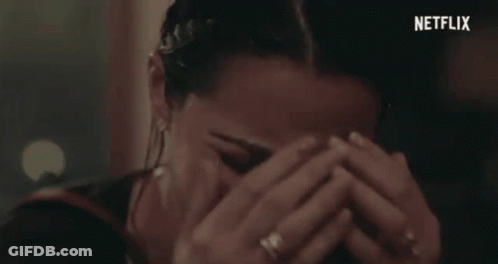Woman Covering Face With Netflix Logo GIF