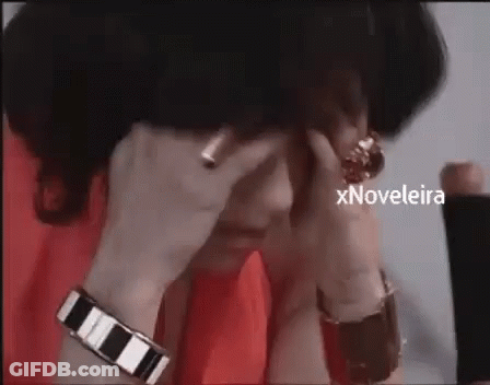 Woman Covering Face With Ring On Finger GIF