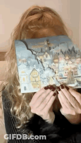 Woman Covering Face With Snowy City Painting GIF