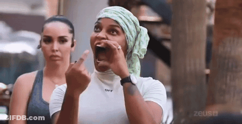 Woman Covering Head In Black Top GIF