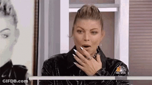 Woman Covering Mouth By Window GIF