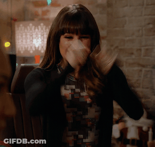 Woman Covering Mouth In Black Sweater GIF