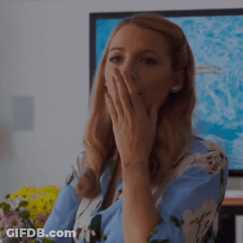 Woman Covering Mouth In Front Of TV GIF