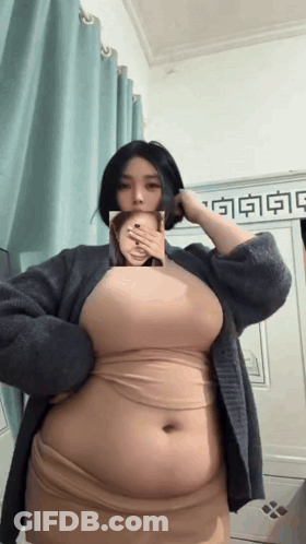 Woman Covering Mouth In Hello Kitty Shirt And Pajamas GIF