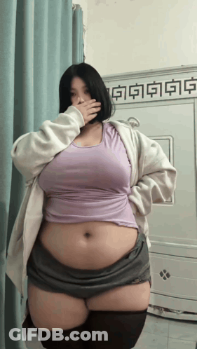 Woman Covering Mouth In Purple Tank Top GIF