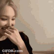 Woman Covering Mouth While Eating GIF