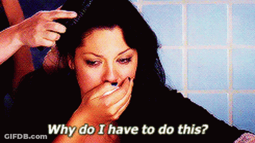 Woman Covering Mouth While Hair Brushed Saying Why Do I Have To Do This GIF