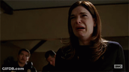 Woman Covering Mouth While Man Looks On GIF