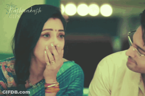 Woman Covering Mouth While Man Looks On With Name Kashinakash GIF